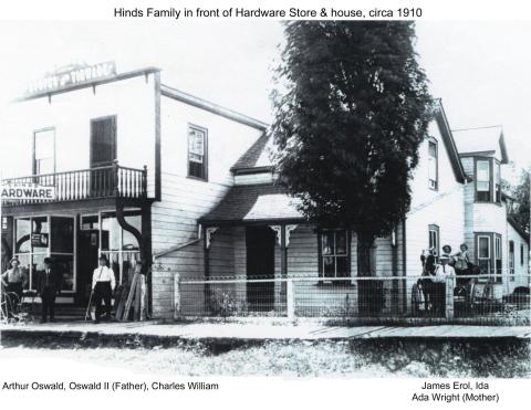 Photo of Oswald Hinds and family outside his hardware store and home
